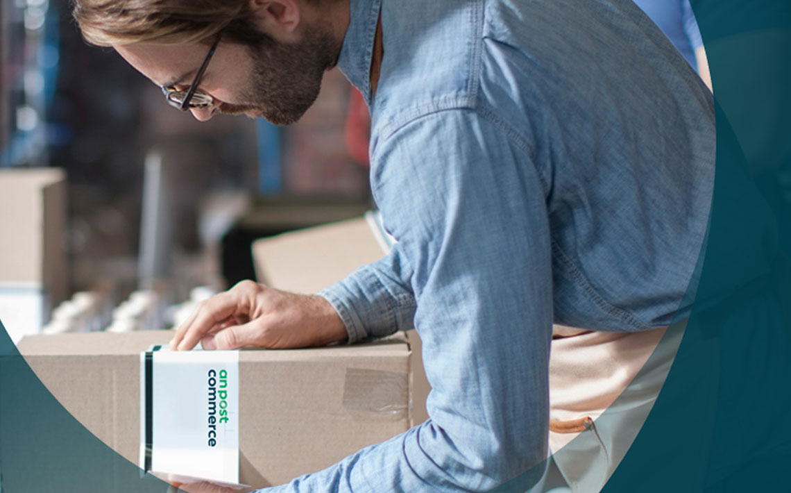 An post employee looking at parcel