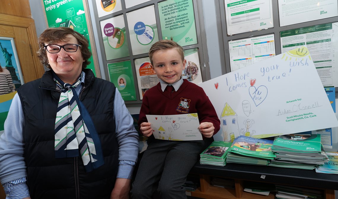 Female An Post Operative delivering Children's Books