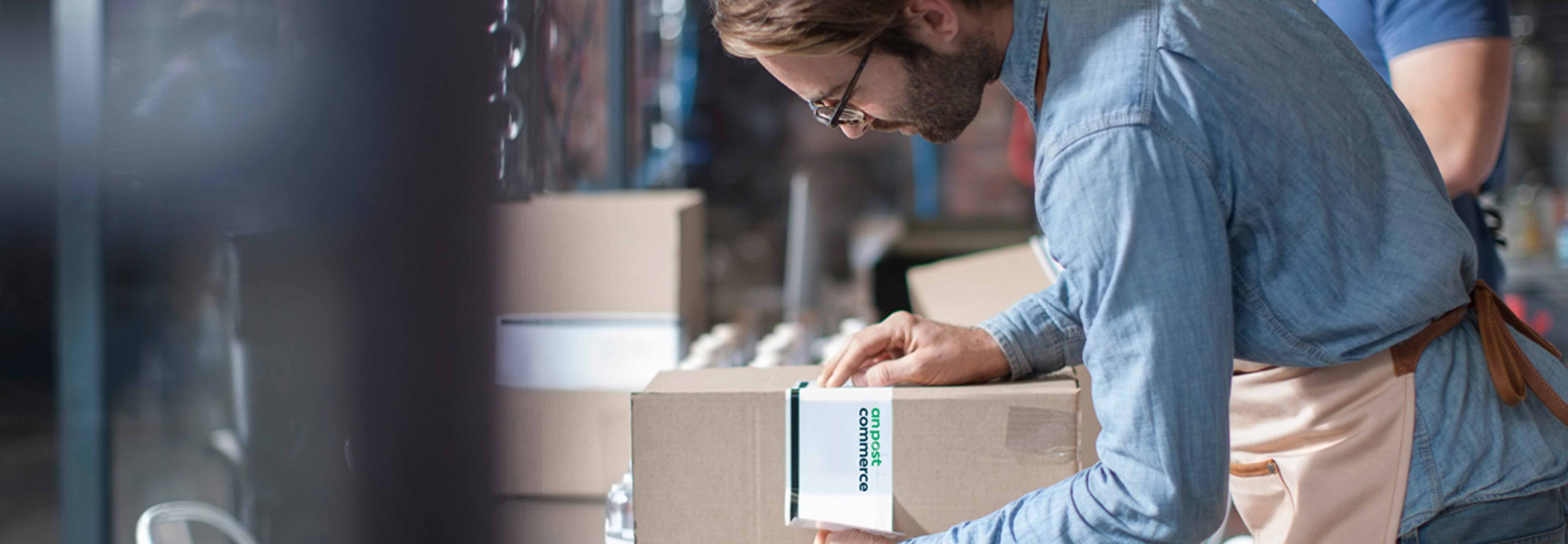 Man checking the label of a box